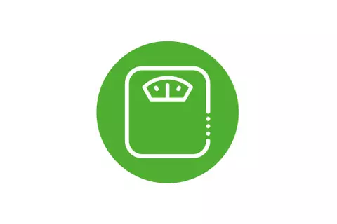 Grünes rundes Icon mit einer Waage - gesundes Gewicht