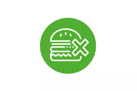Grünes rundes Icon mit einem durchgestrichenen Hamburger - Richtig essen