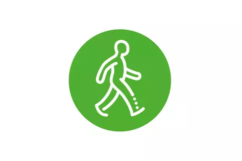 Grünes rundes Icon mit einem spazierenden Männchen - aktiv bleiben
